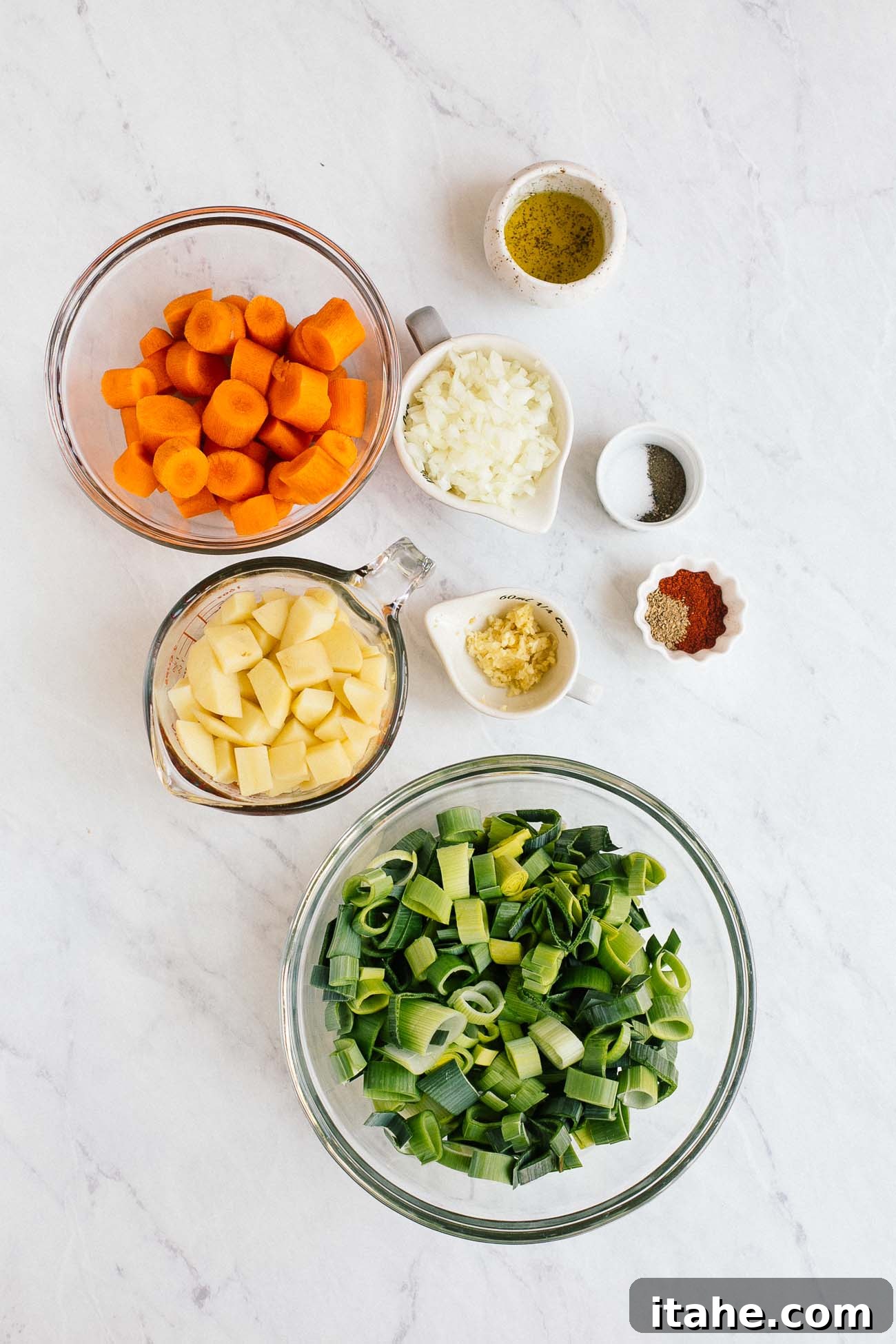 Velvety Carrot Leek Soup 3 Overhead image of ingredients needed to make carrot leek soup.