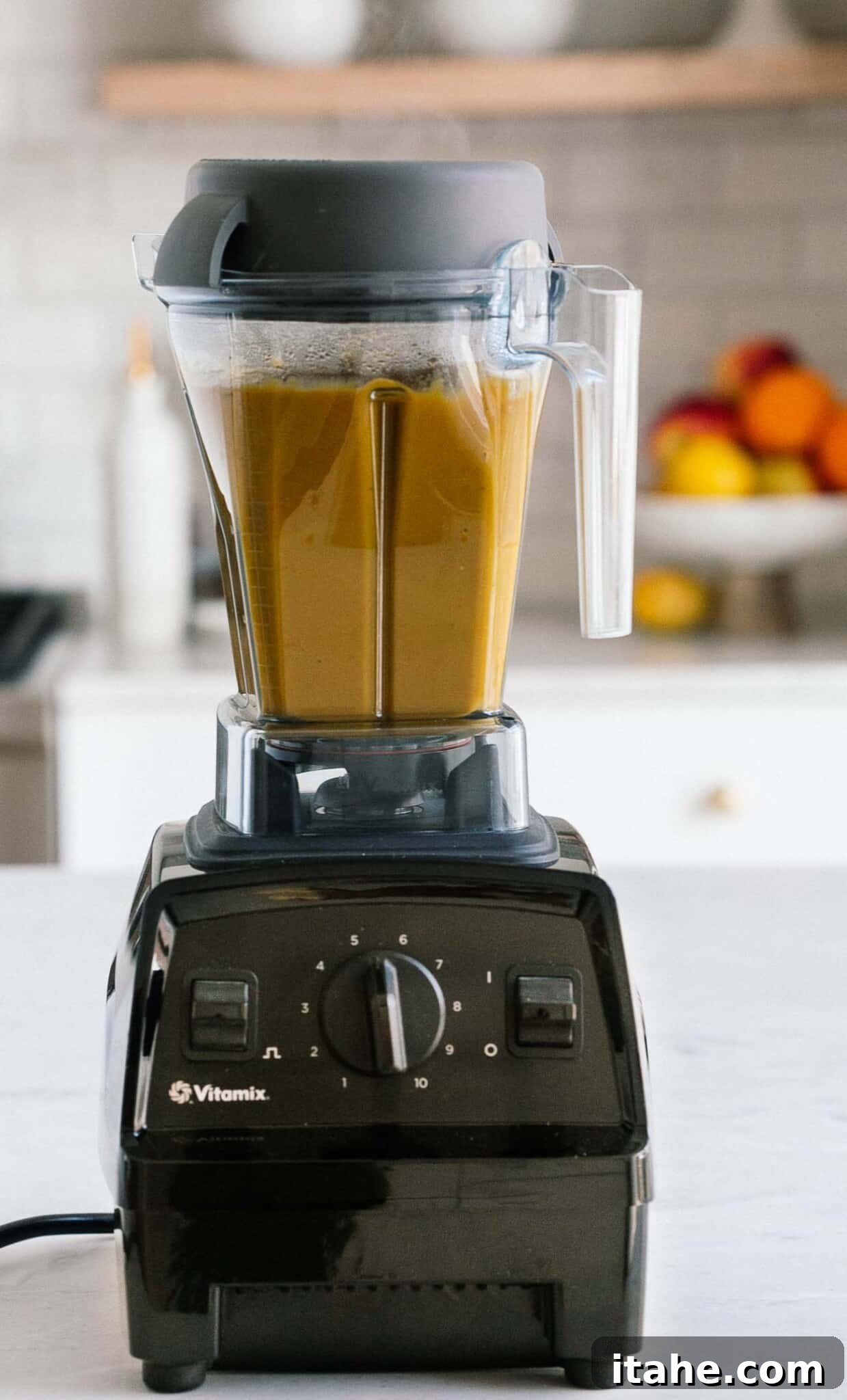 Velvety Carrot Leek Soup 7 Vitamix blender blending up carrot leek soup.