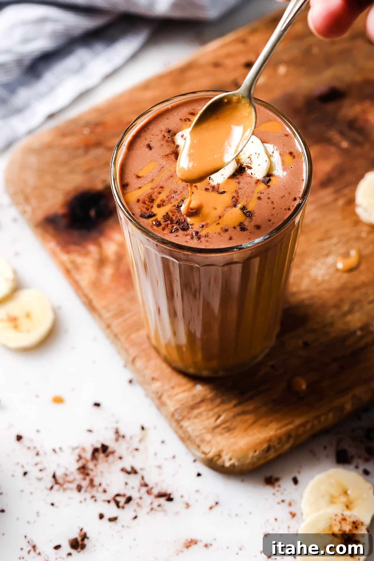An overhead view of a peanut butter chocolate smoothie, showcasing its rich, creamy texture.