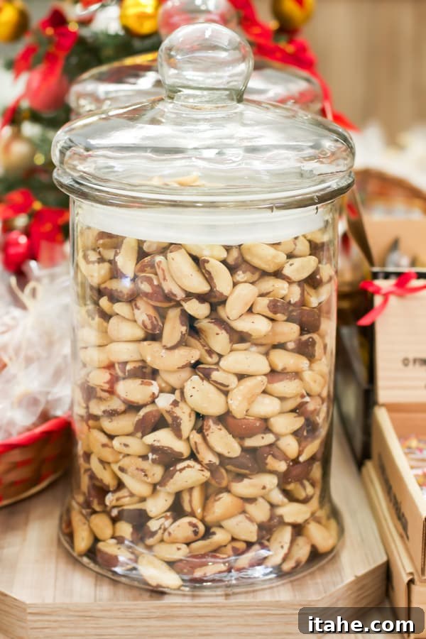 Brazilian Feiras: A Taste of Local Life 15 A large, clear glass jar abundantly filled with fresh, whole Brazil nuts, ready for sale.