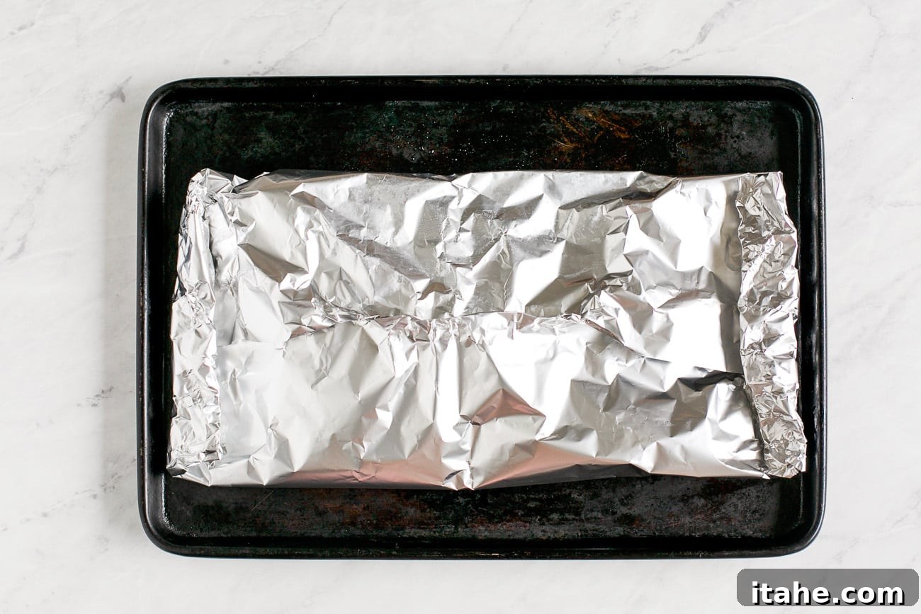 Mouthwatering Garlic Butter Salmon 7 close up view of the fish folded in foil