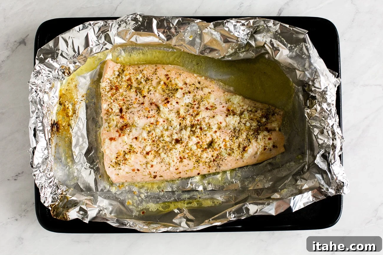 Mouthwatering Garlic Butter Salmon 8 overhead view of cooked fish in a foil