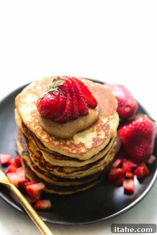 Blender-Made 3-Ingredient Almond Flour Pancake Recipe - Gluten-Free & Protein-Packed Delicious 3-Ingredient Almond Flour Pancakes on a plate with fresh berries