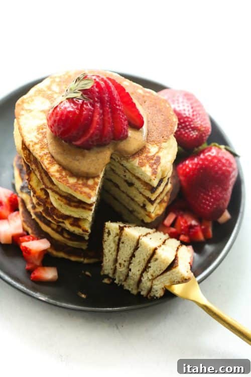 Quick & Easy Blender Almond Flour Pancakes for a Healthy Breakfast Stacked 3-Ingredient Almond Flour Pancakes with fresh berries and almond butter