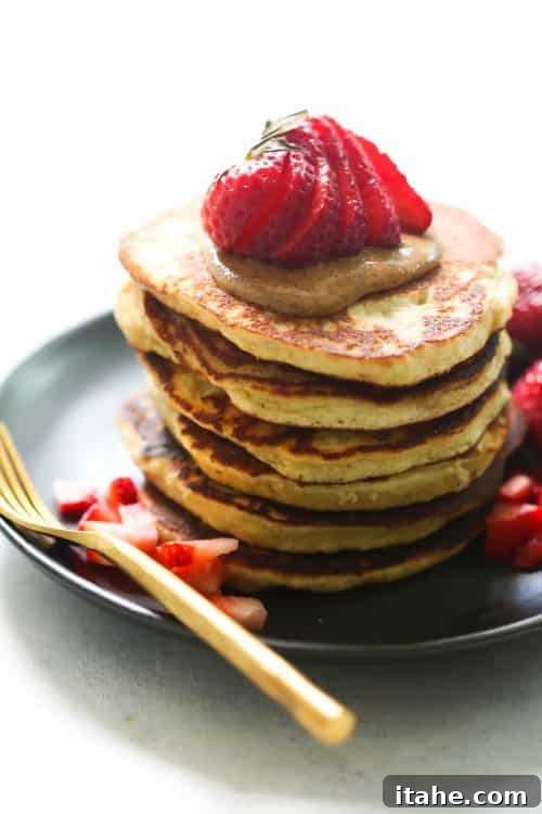 Healthy 3-Ingredient Almond Flour Pancakes - Gluten-Free & Delicious Close-up of fluffy 3-Ingredient Almond Flour Pancakes topped with fresh fruit and almond butter