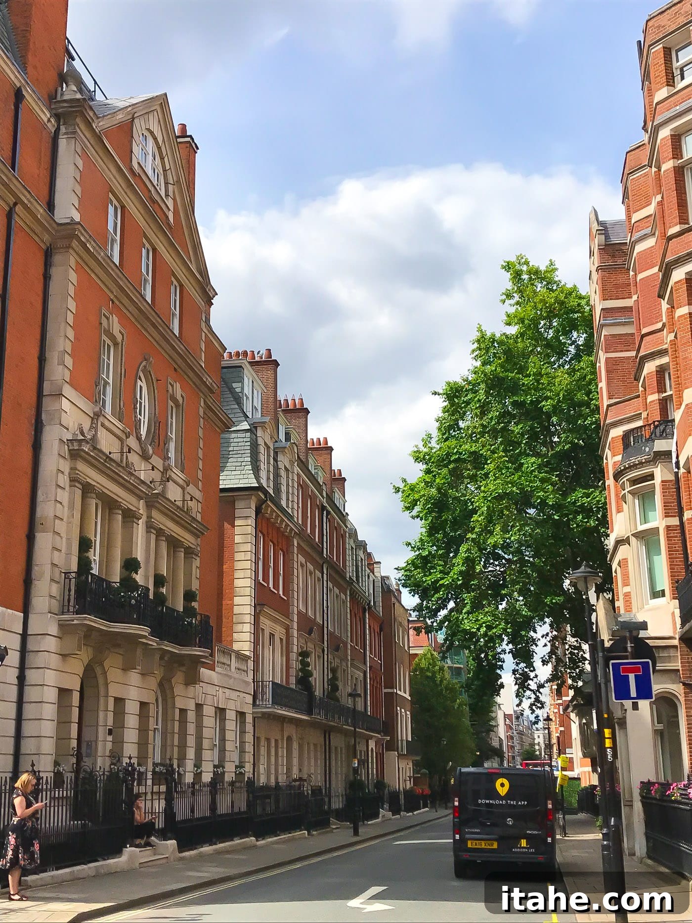 A vibrant London street lined with elegant, historic buildings