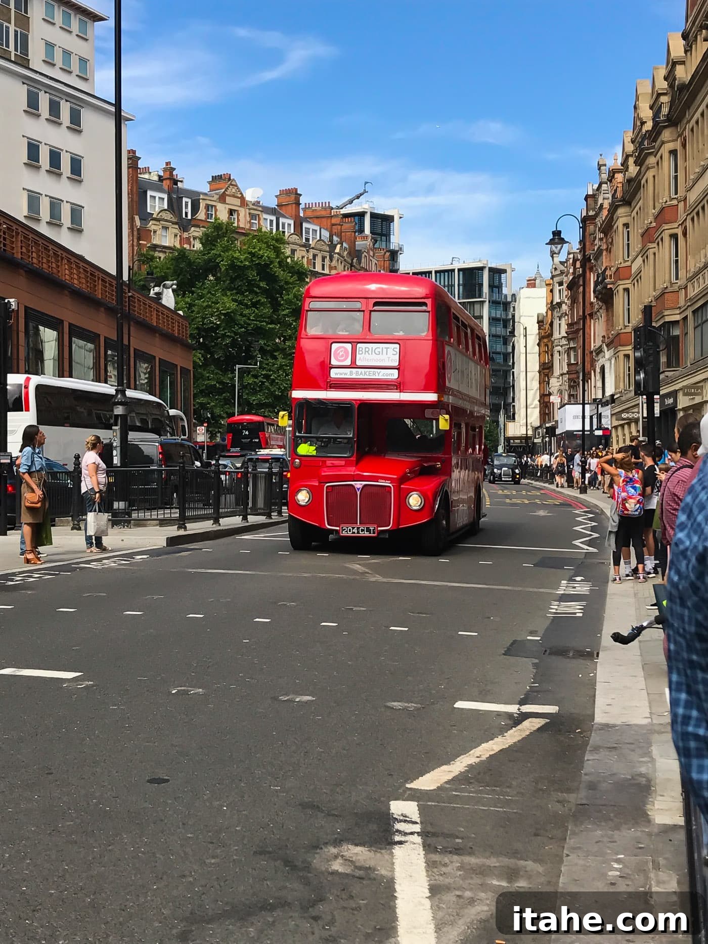 A classic red English double-decker bus, a quintessential London sight