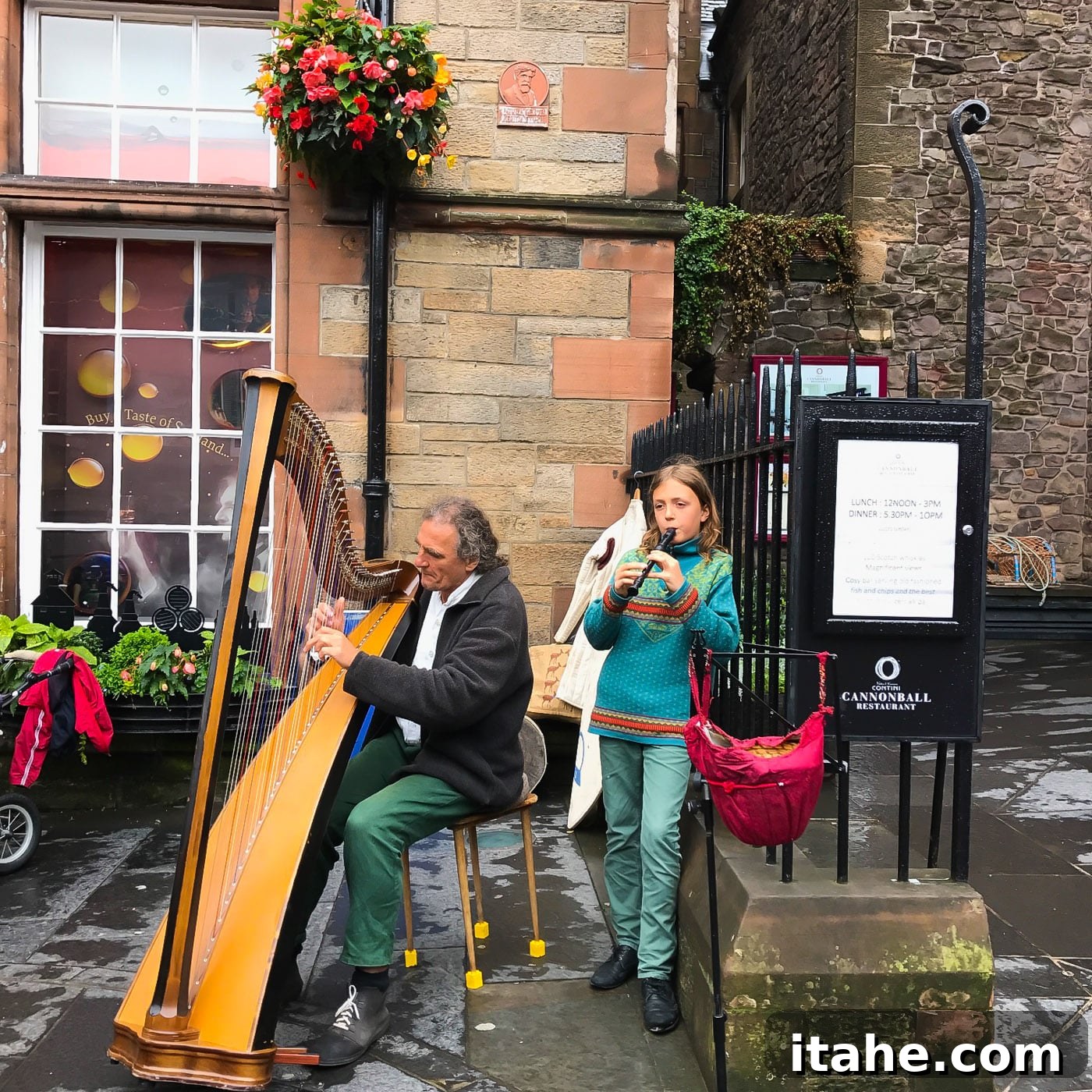 Musicians playing flute and harp on the lively streets of Edinburgh