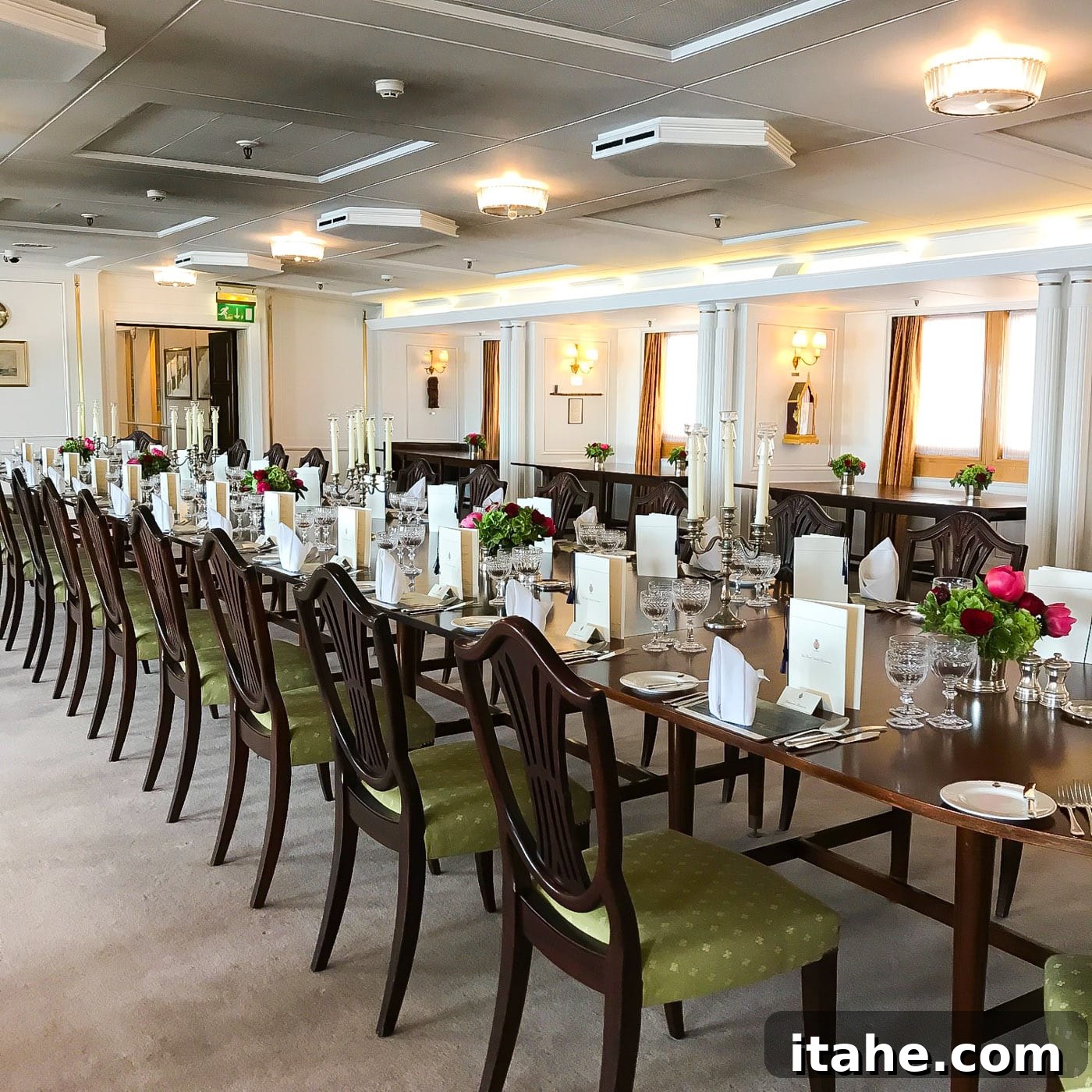 The opulent dining room inside The Royal Yacht Britannia, set for a formal meal