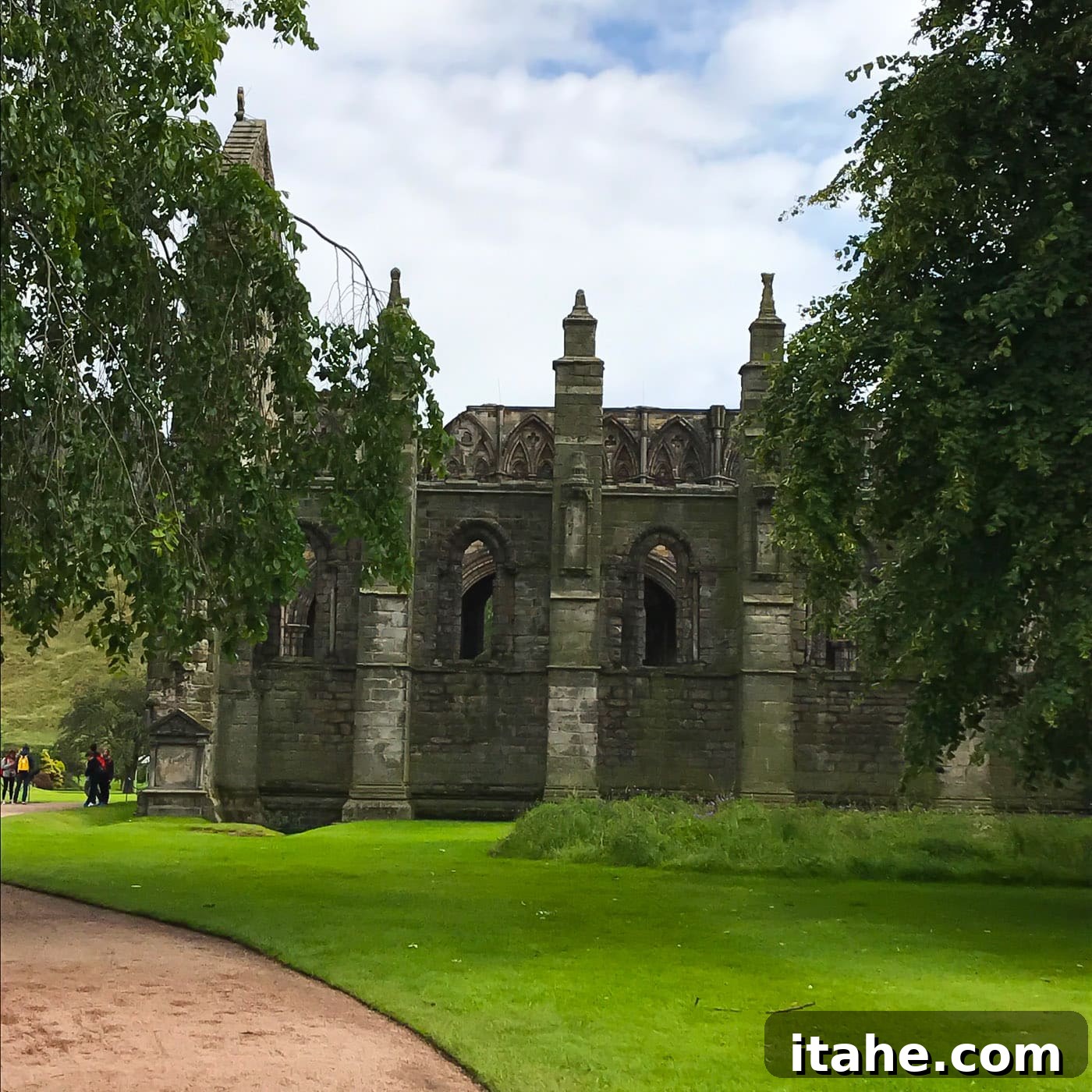 A picturesque view of the grounds surrounding The Palace of Holyroodhouse