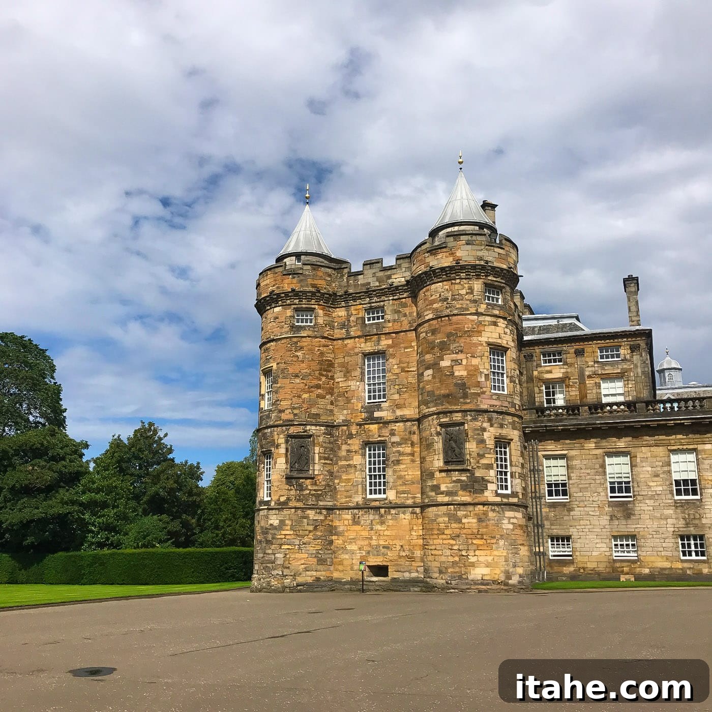 The majestic entrance to The Palace of Holyroodhouse, inviting visitors inside