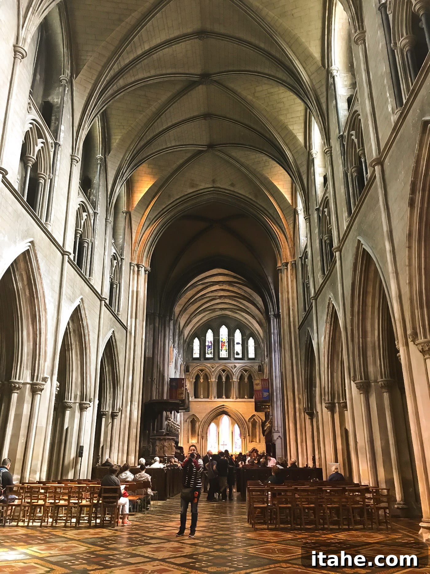 The magnificent interior of St. Patrick's Cathedral in Dublin, featuring stunning stained glass