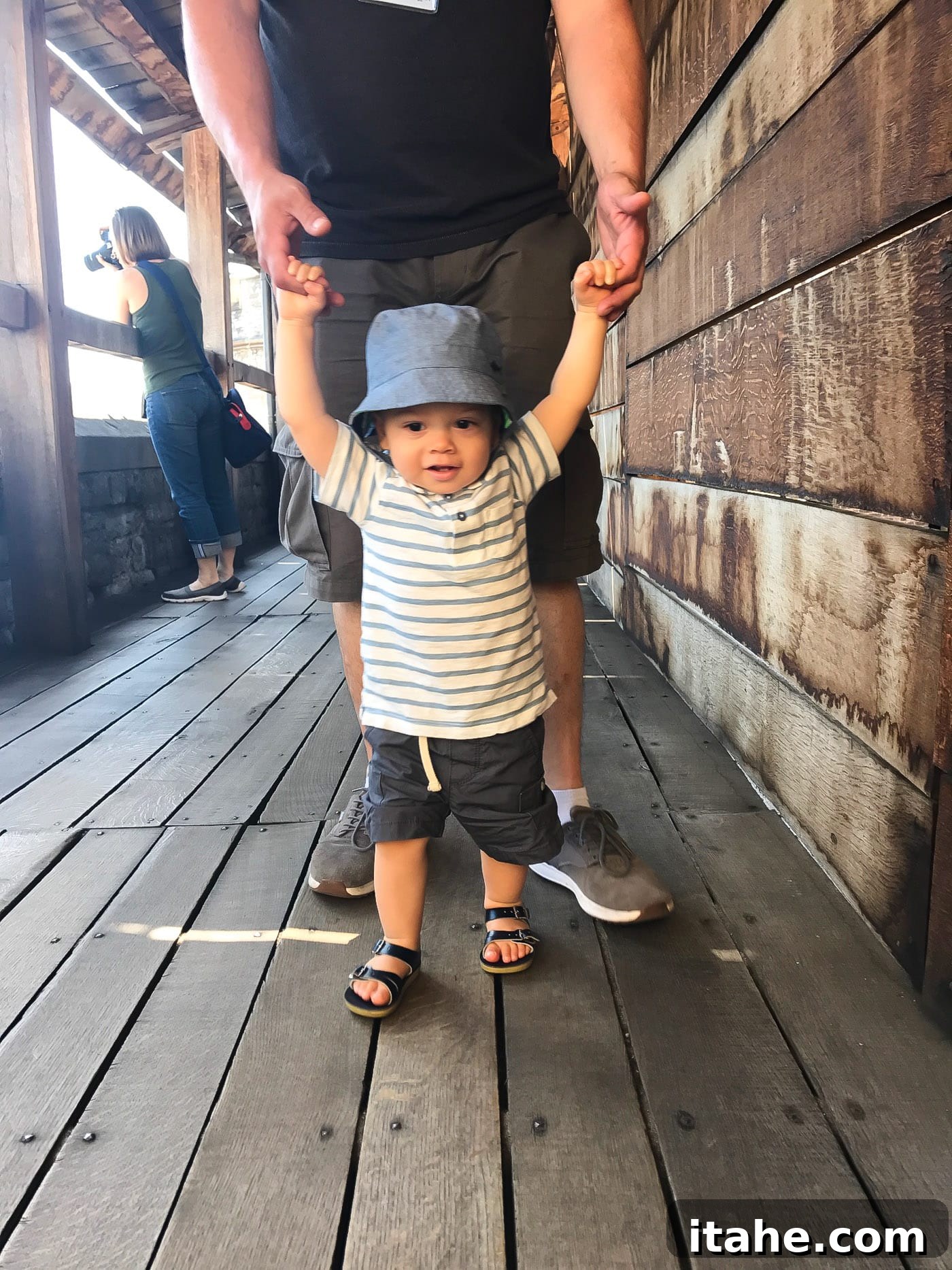 A father and toddler exploring the vibrant streets of London together