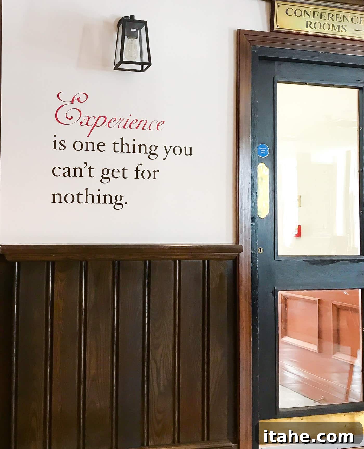 A wall at Oscar's Bar & Kitchen featuring an Oscar Wilde quote: 'Experience is one thing you can't get for nothing.'
