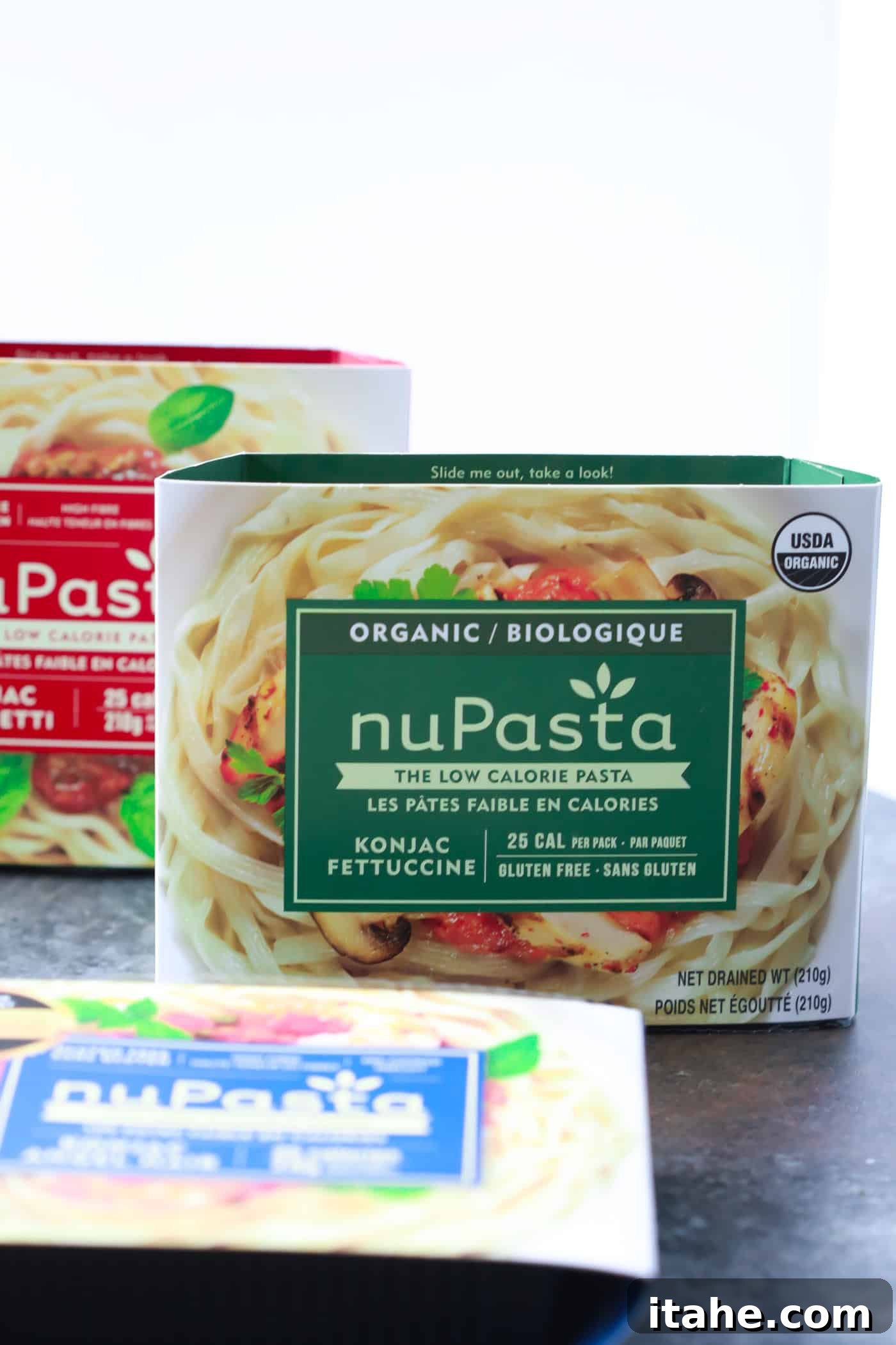 Quick & Easy nuPasta Dinners A plate of Italian Sausage Sun-dried Tomato Pesto Pasta, garnished with fresh basil and Parmesan cheese