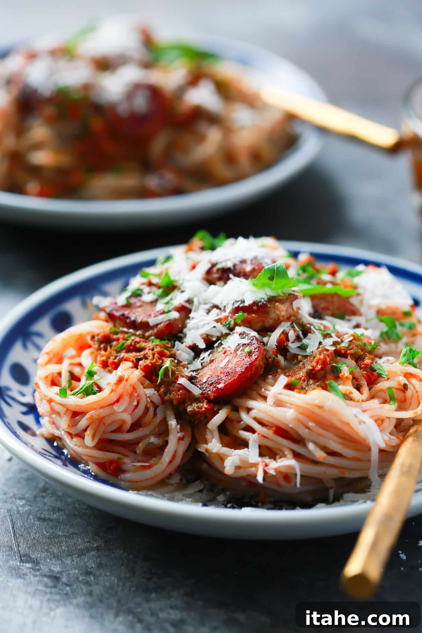 Delicious Italian Sausage & Pesto Pasta Close-up of a serving of Italian Sausage Sun-dried Tomato Pesto Pasta, ready to be enjoyed