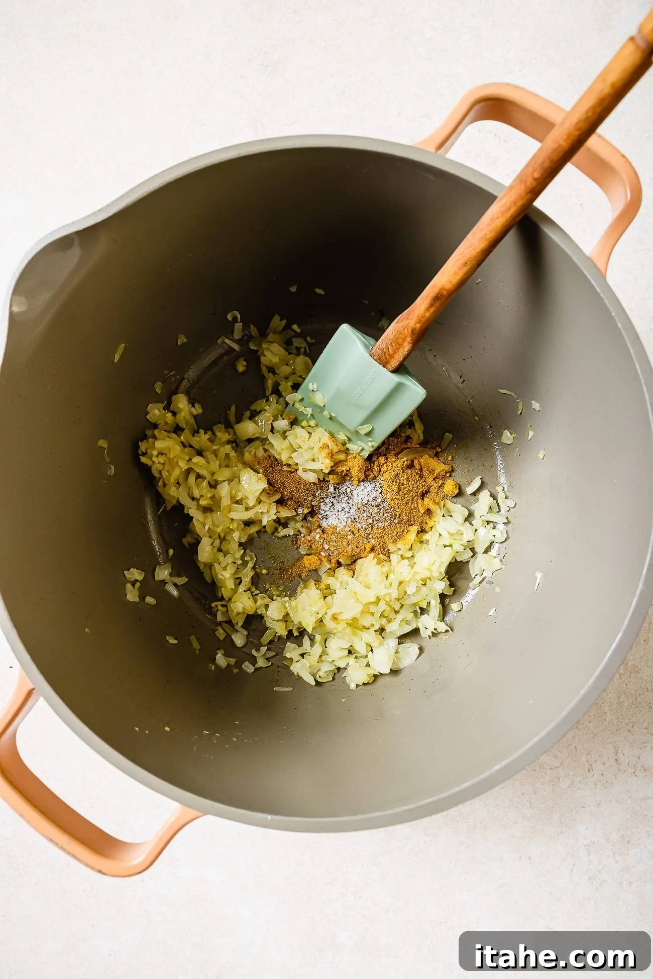 Onions, garlic, and spices in a large Dutch oven. 