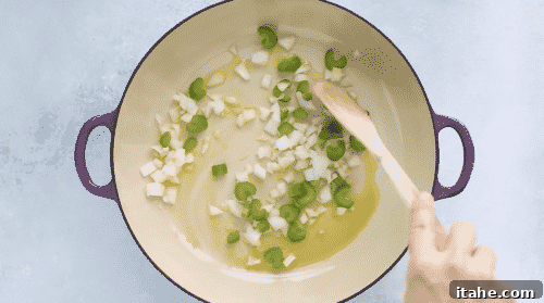 Low-Carb Cauliflower Rice 8 Onions and celery sauteing in a skillet