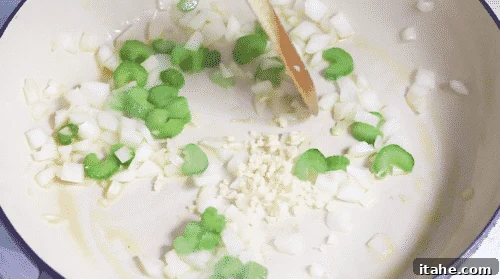 Low-Carb Cauliflower Rice 9 Garlic cooking in a skillet
