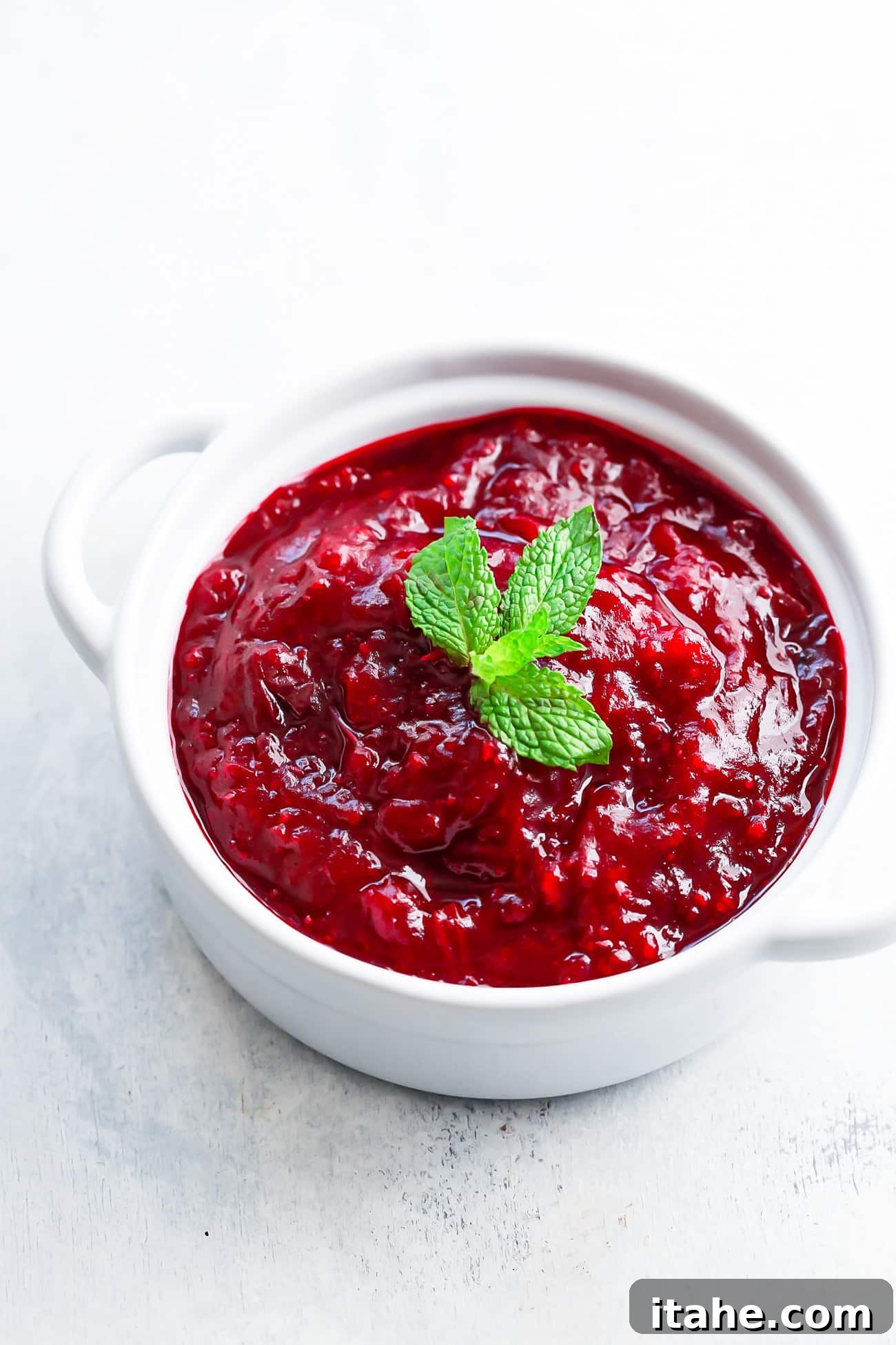 overhead view of instant pot cranberry sauce in a white pot.