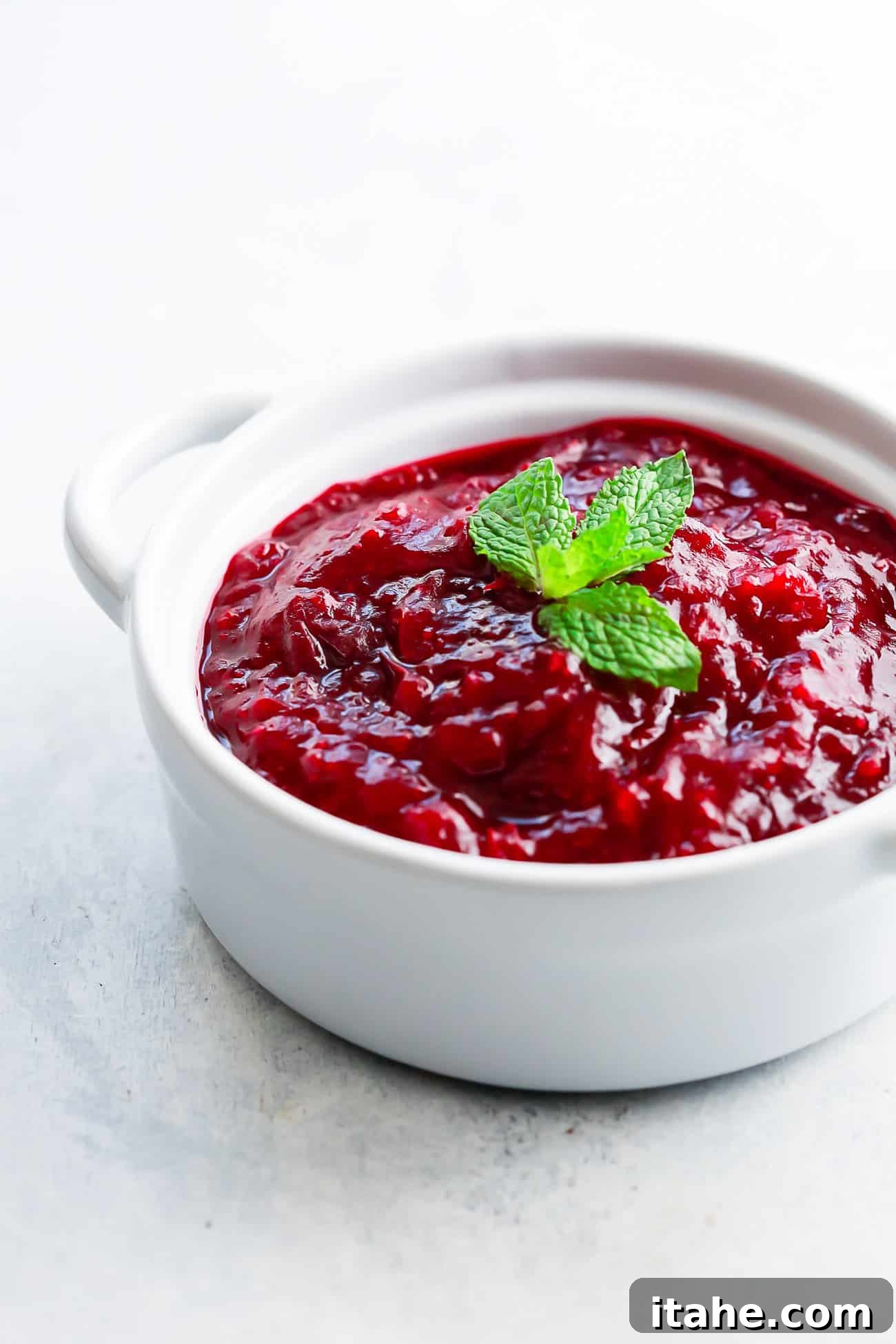overhead view of instant pot cranberry sauce in a white pot.