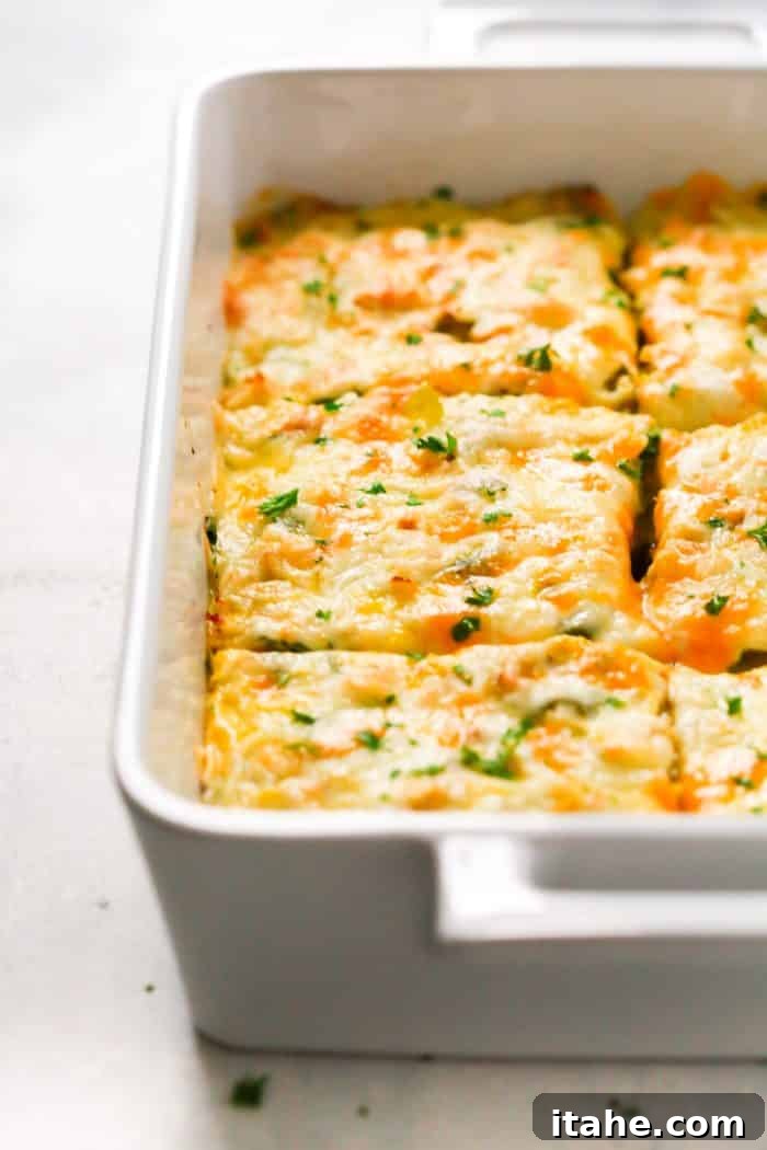 Up-close view of a vibrant Make-Ahead Veggie Breakfast Casserole cooling after baking, showing delicious textures.