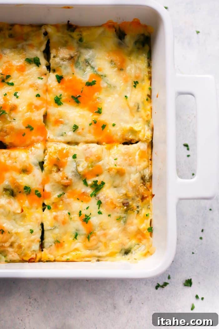 Beautifully baked Make-Ahead Veggie Breakfast Casserole, garnished with fresh herbs, ready to be served.