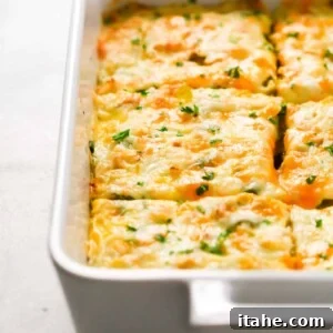 A vibrant and cheesy Make-Ahead Veggie Breakfast Casserole, ready for serving.