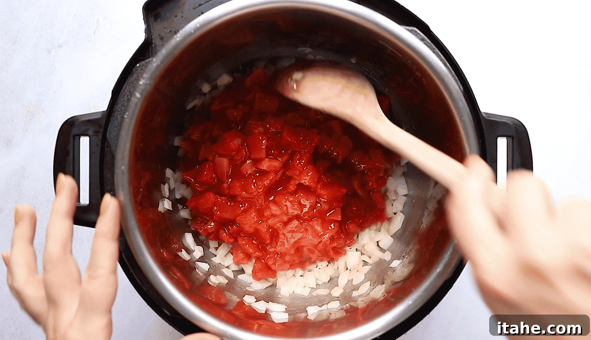 Quick Instant Pot Mediterranean Chicken 4 Overhead view of an Instant pot with tomatoes and onions.