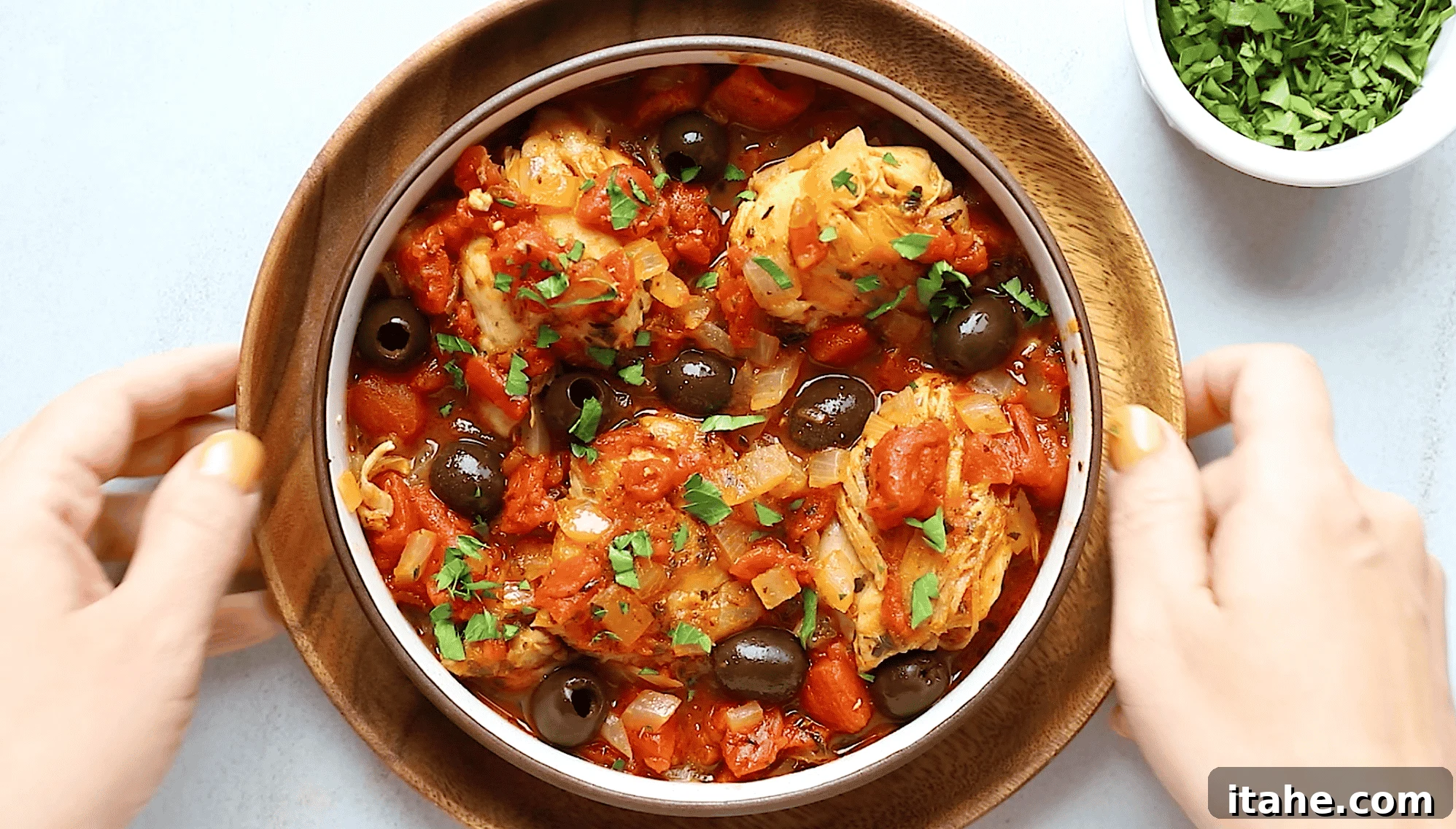 Quick Instant Pot Mediterranean Chicken 6 Overhead view of instant pot chicken recipe with tomato sauce in a bowl.