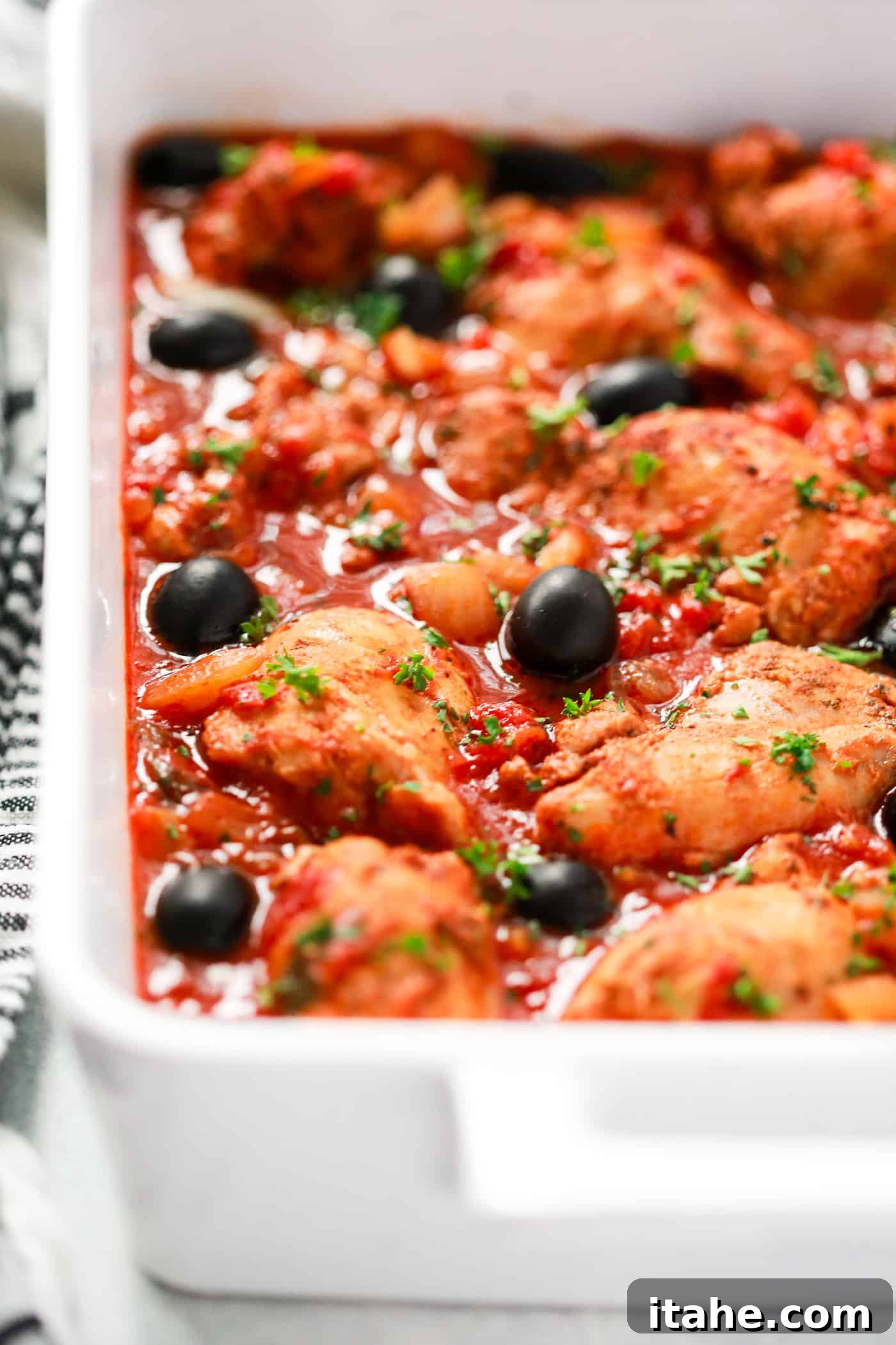 Instant Pot Mediterranean Chicken Recipe - Primavera Kitchen Chicken with tomato sauce in a white serving dish