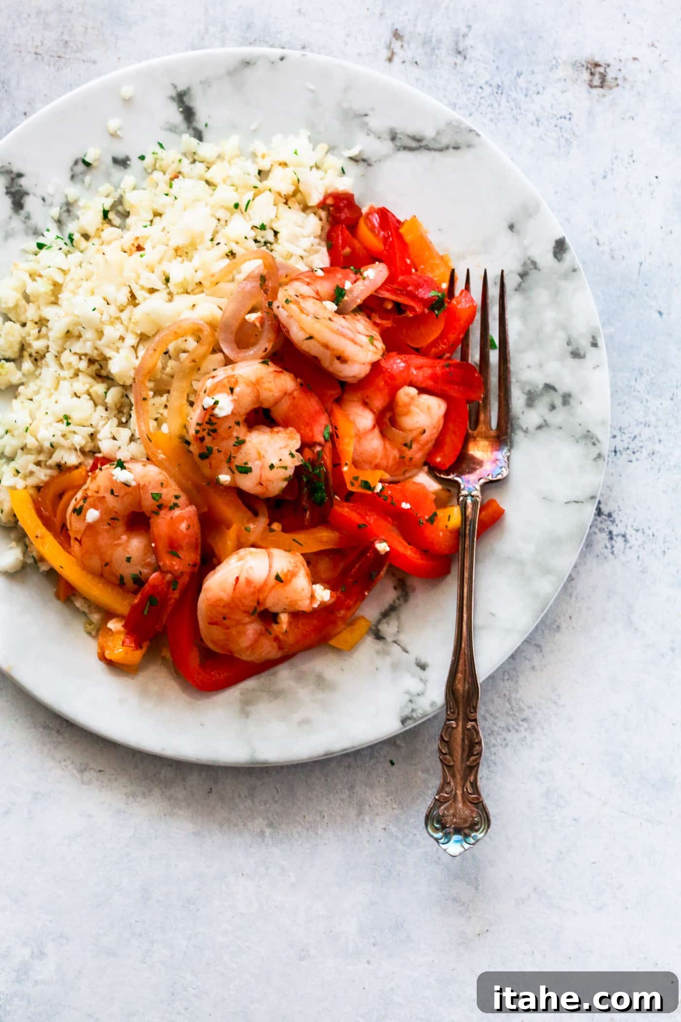 Shrimp, Bell Pepper and Onions Skillet served with rice and fresh parsley