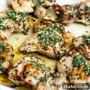 Chimichurri chicken in a large, white skillet.