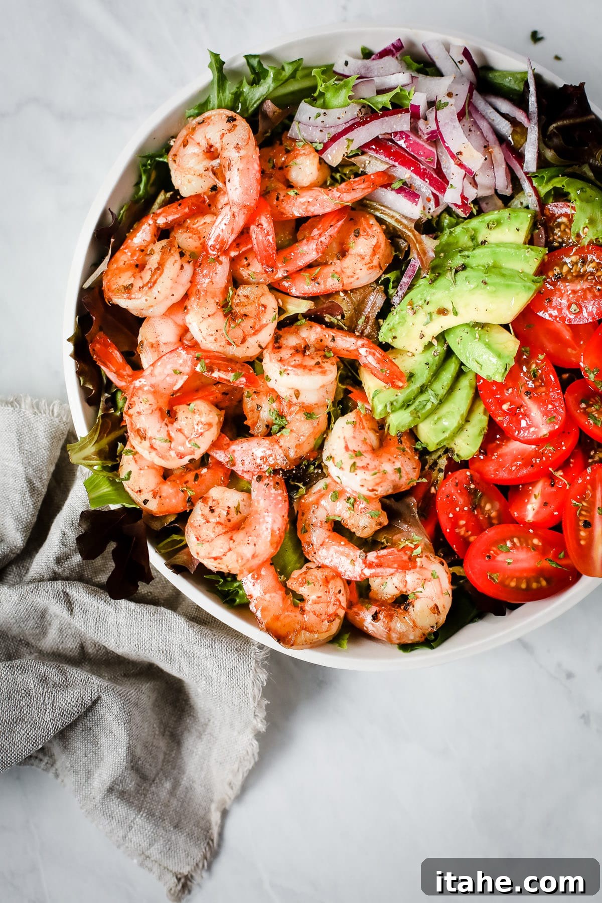 Bright Shrimp and Ripe Tomato Salad 5 Super Fresh Shrimp Tomato Salad served in a stylish bowl, garnished with fresh herbs, showcasing its vibrant colors.