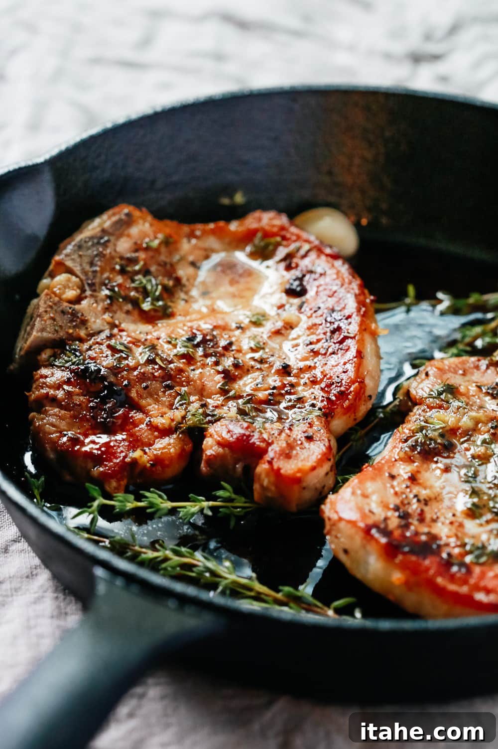 Mouthwatering Garlic Butter Baked Pork Chops 3 CLose-up view of the baked pork chops