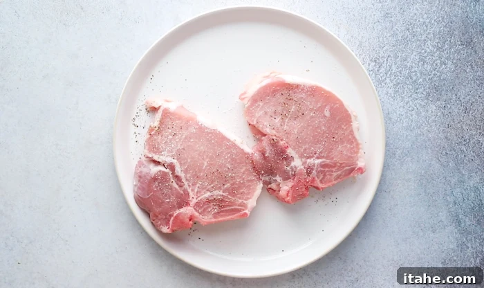 Mouthwatering Garlic Butter Baked Pork Chops 4 season pork chops with salt and black pepper