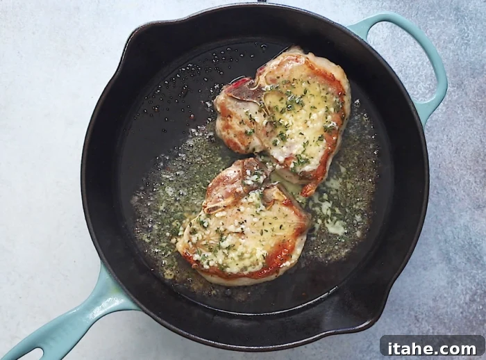 Mouthwatering Garlic Butter Baked Pork Chops 6 pour garlic butter on top of the pork chops