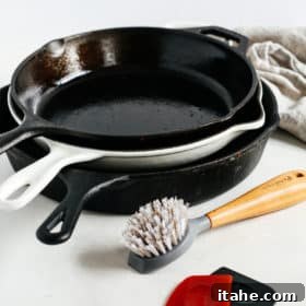 3 cast iron skillets in a countertop