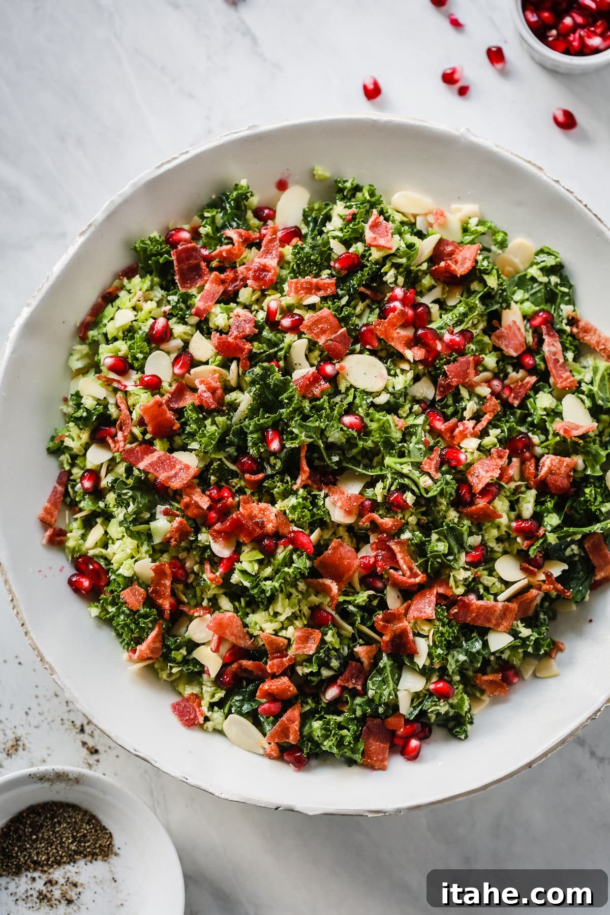 Close-up of Shredded Brussels Sprout Salad with crispy bacon and pomegranate
