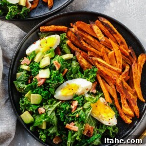 overhead view of a kale salad with sweet potato plate