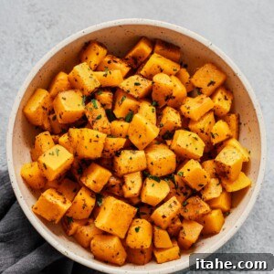 Overhead photo of a white bowl of roasted butternut squash.