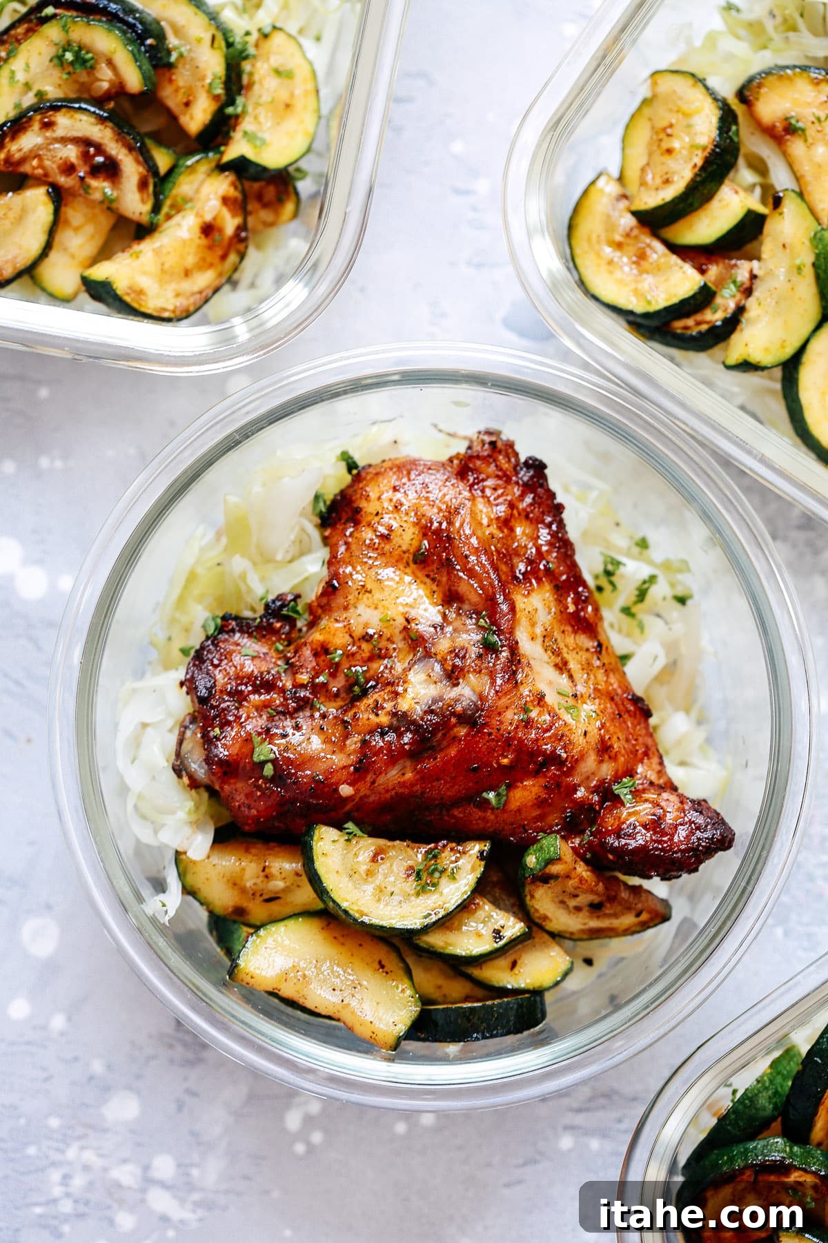 Spicy chicken and vegetables in a glass meal prep container