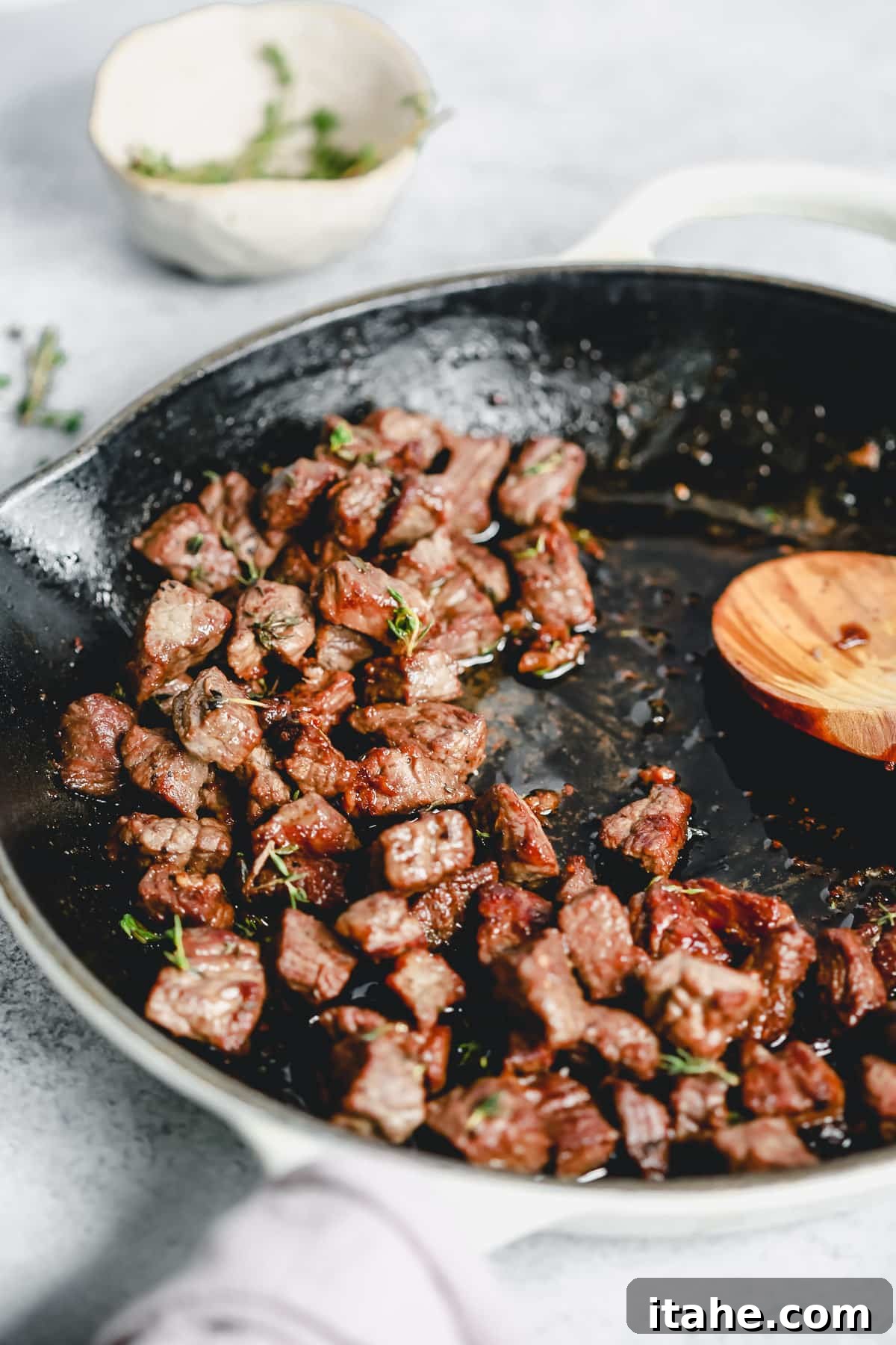 making a skillet steak recipe with garlic butter