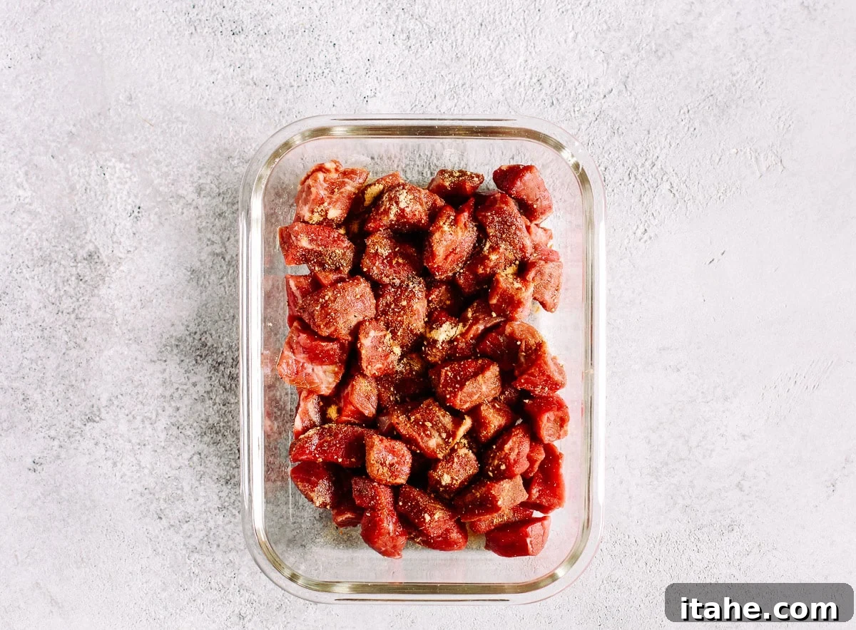 raw beef sirloin in glass meal prep container