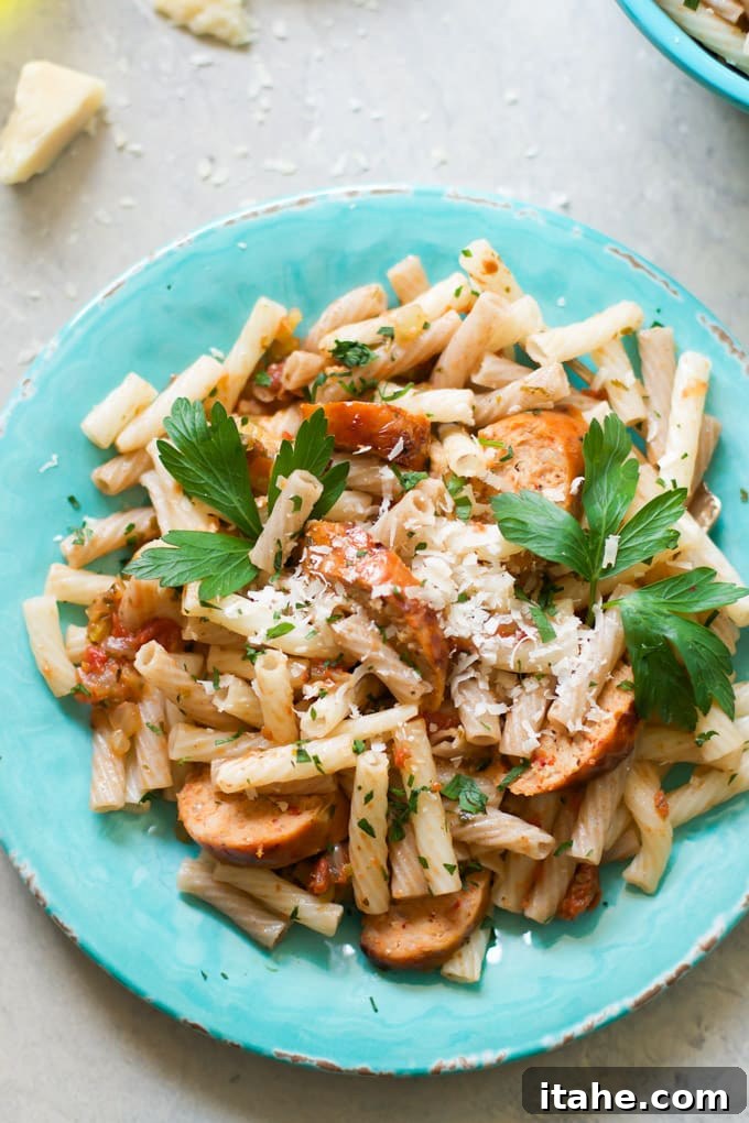 Sausage Quinoa Pasta garnished with fresh parsley and parmesan