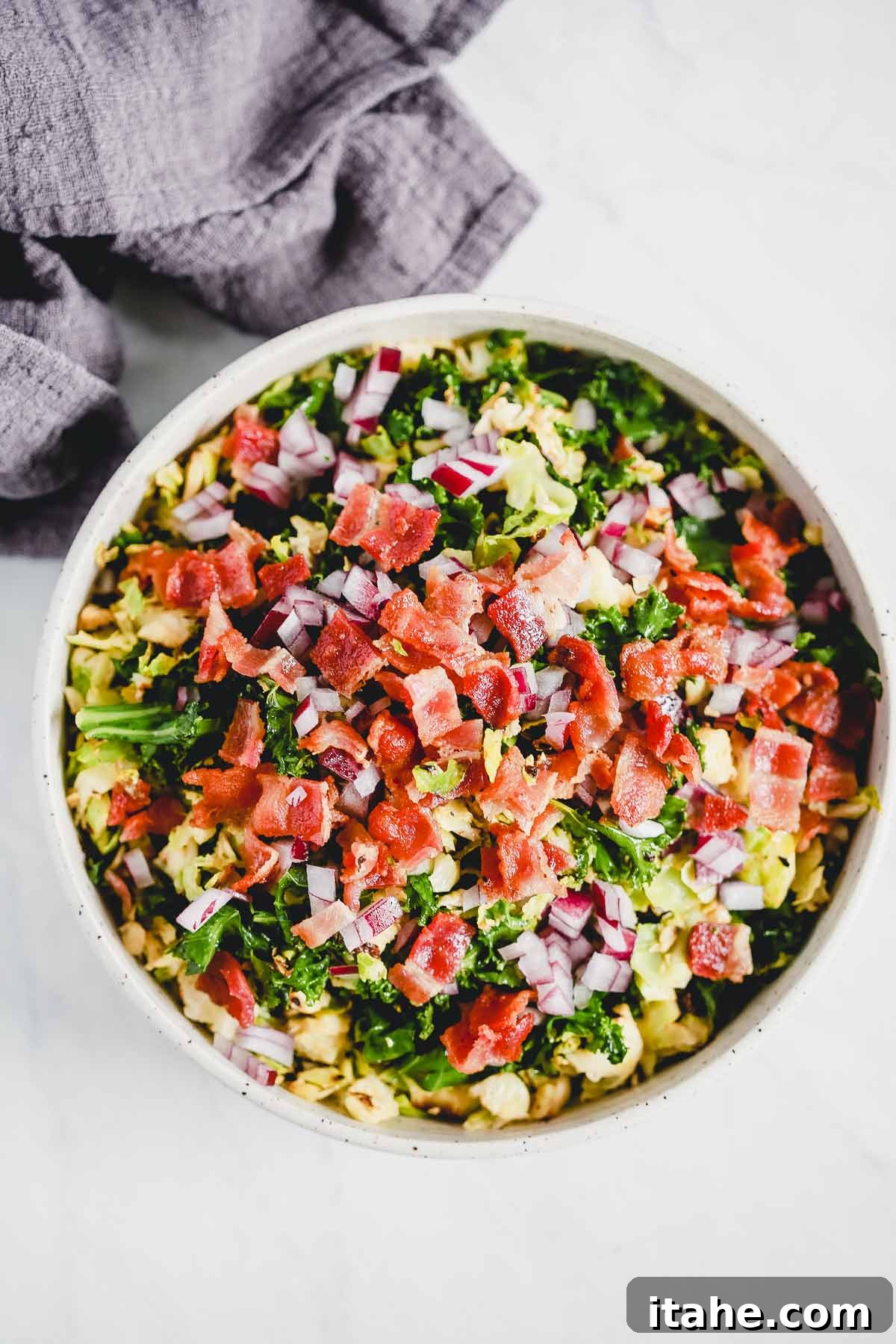 a large bowl with Brussels Sprouts Bacon Salad