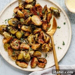 overhead view of Roasted Brussels sprouts with Mayo Mustard Dressing on a serving platter.