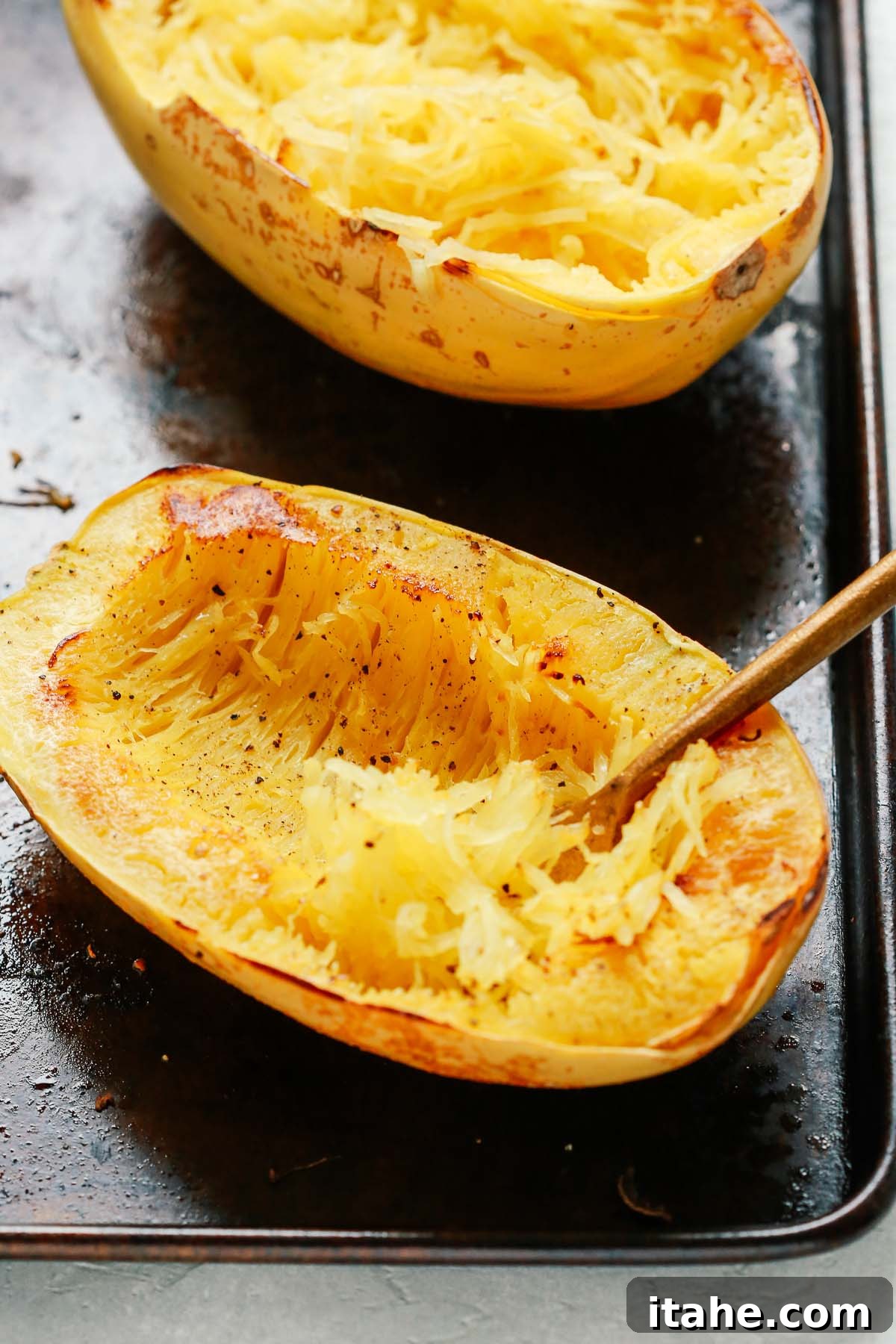 Roasted spaghetti squash with fork-scraped strands, resembling pasta.