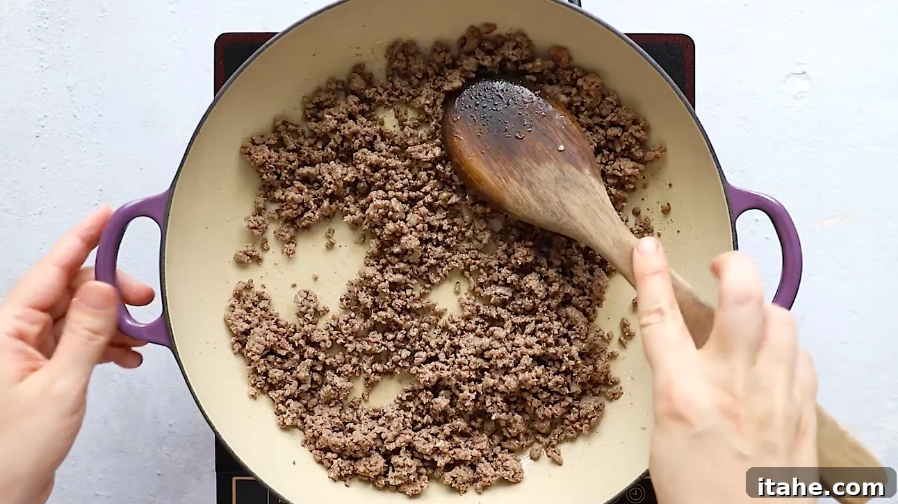 Unwrapped Egg Roll Bowl 3 Ground beef, cabbage, and carrots stir-fried together in a skillet for Egg Roll in a Bowl.