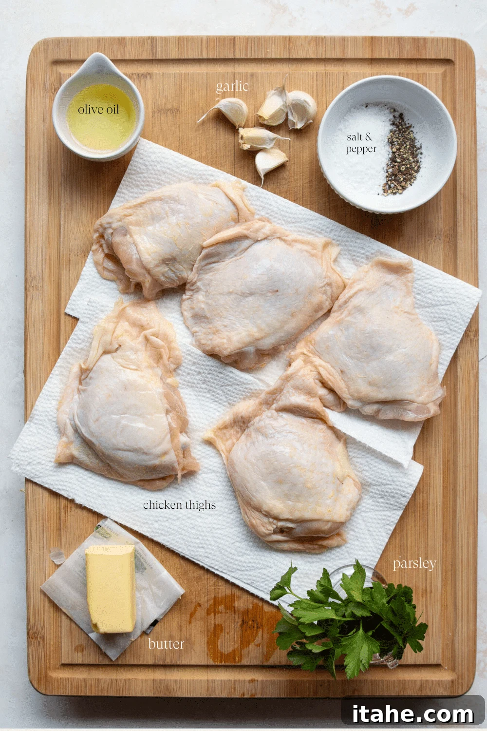 Overhead view of ingredients on a wooden board. 